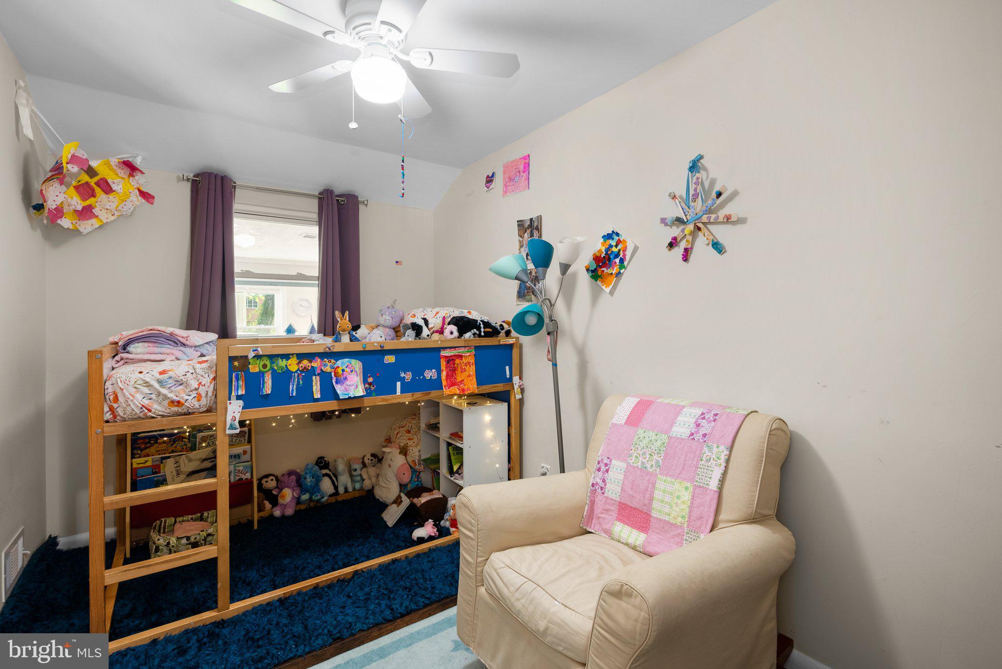 12837 Flack Street Silver Spring, MD 20906 - Photo 16 of 26 a living room with furniture and book shelf