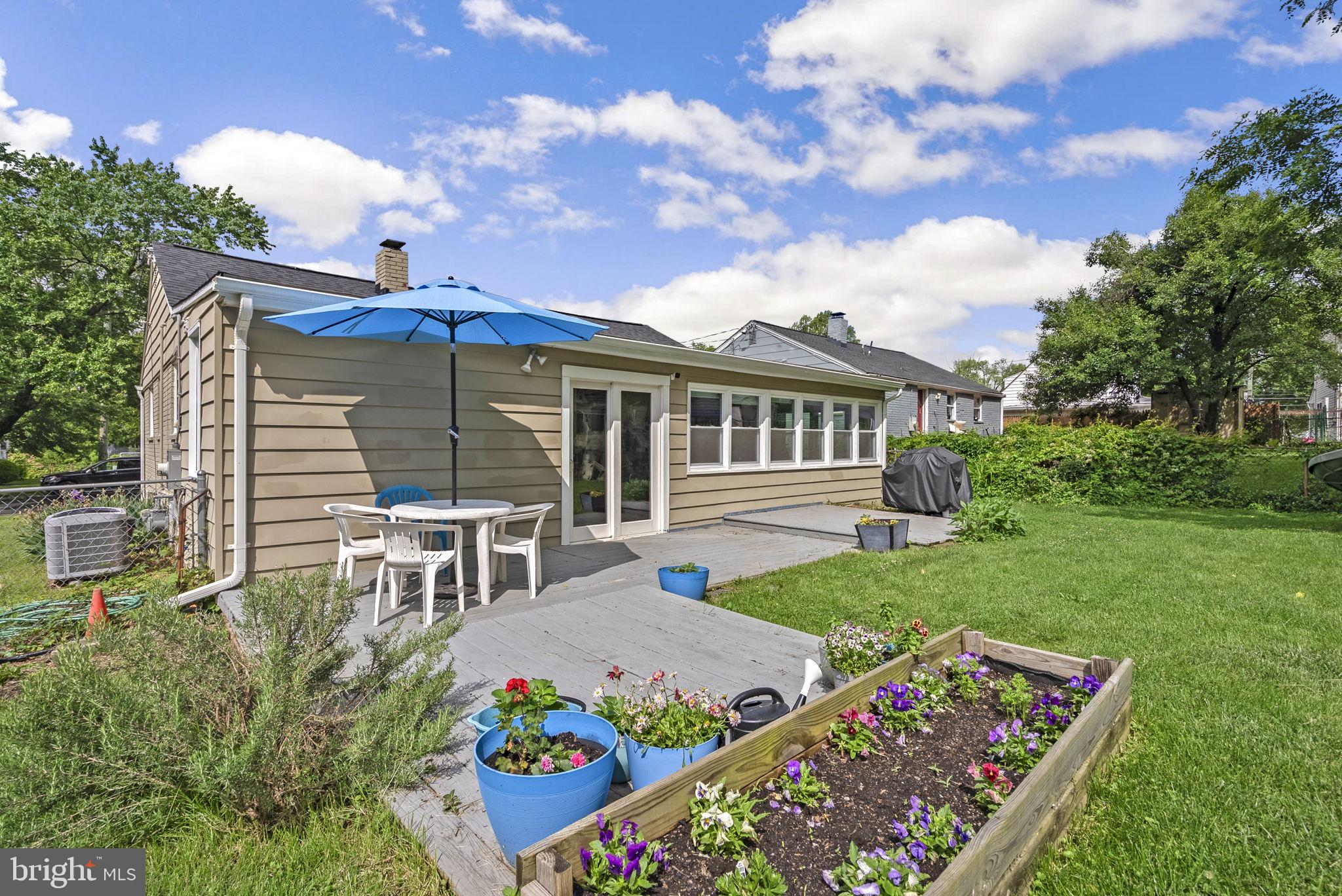 12837 Flack Street Silver Spring, MD 20906 - Photo 21 of 26 a view of a house with backyard and sitting area