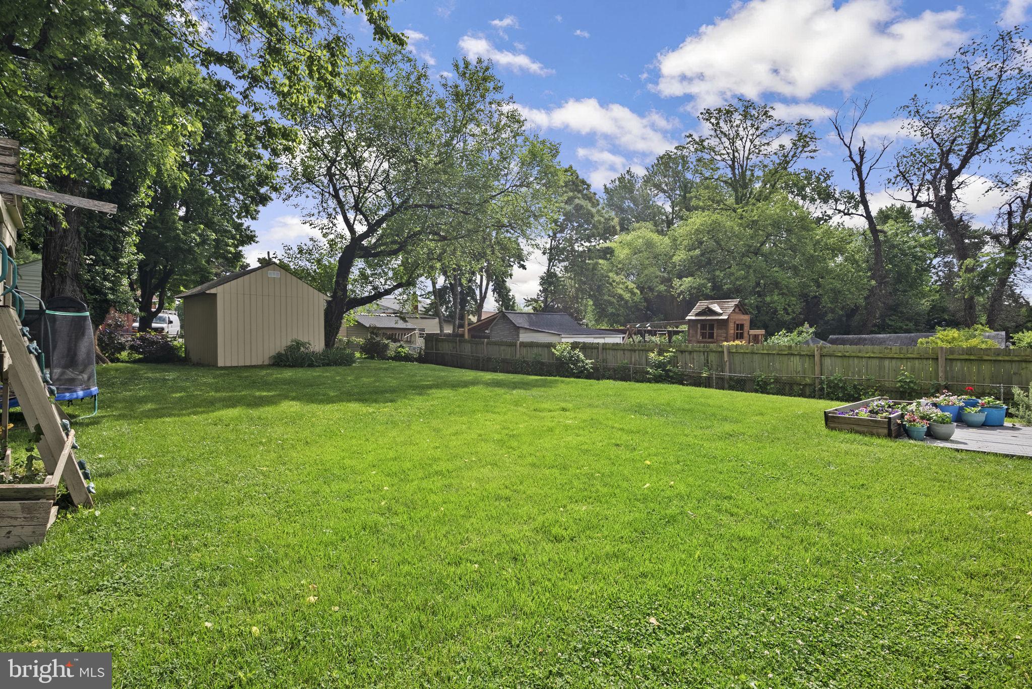 12837 Flack Street Silver Spring, MD 20906 - Photo 22 of 26 a view of a field of grass and trees