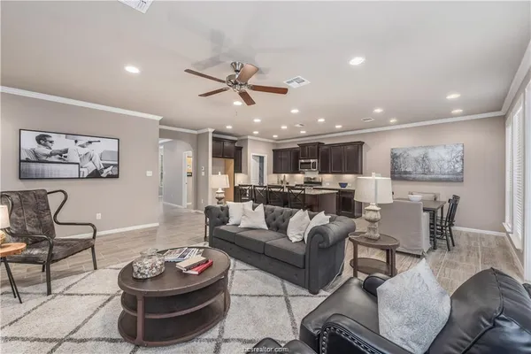 a kitchen with center island table and chairs