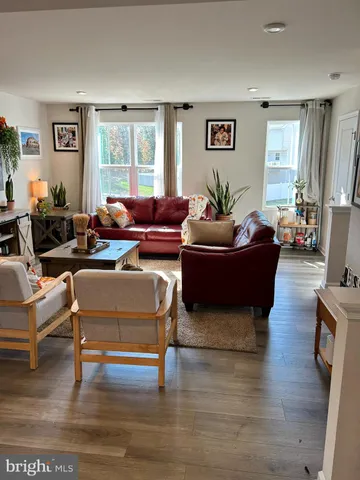 a living room with furniture or couch and a window