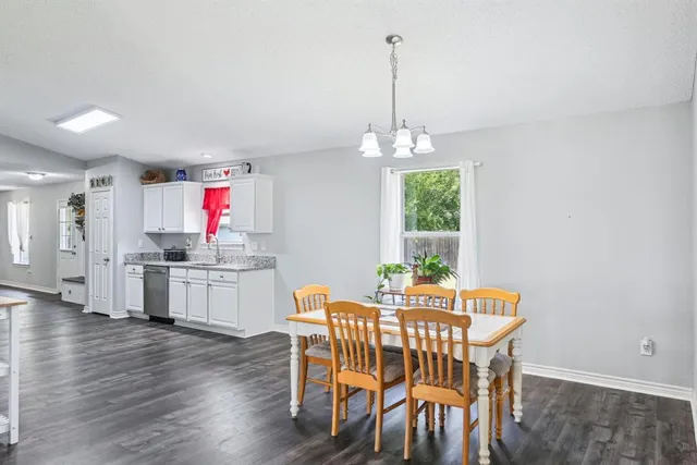 a dining room with furniture and window