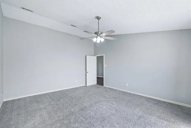 a view of a room with a fan