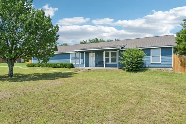 a view of a house with a garden