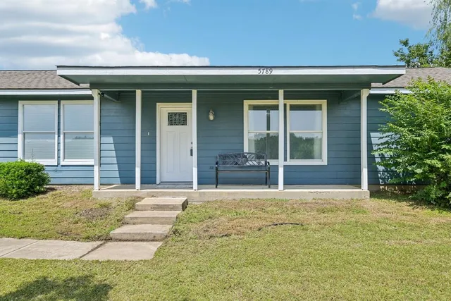 a house with yard in front of it