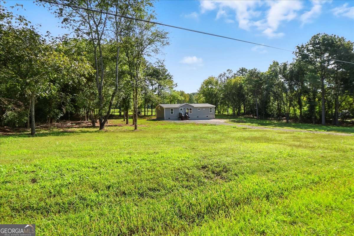 285 Trotters Way Jefferson, GA 30549 - Photo 26 of 28 a view of a park with large trees