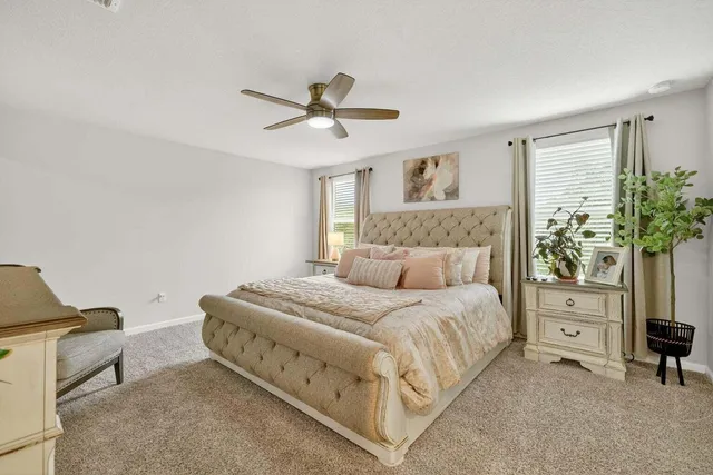 a bedroom with a bed and a dresser