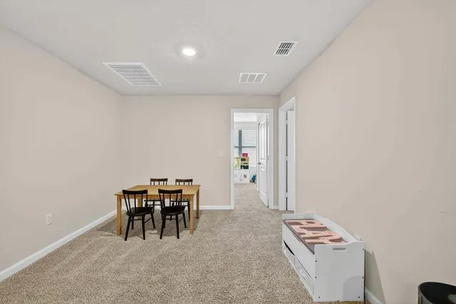 a view of room with windows and lounge chair
