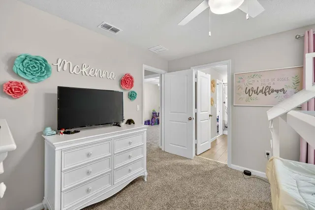 a room with furniture and flat screen tv