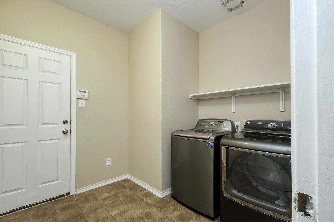 1244 Yellow Iris Road Leander, TX 78641 - Photo 22 of 25 a utility room with washer and dryer