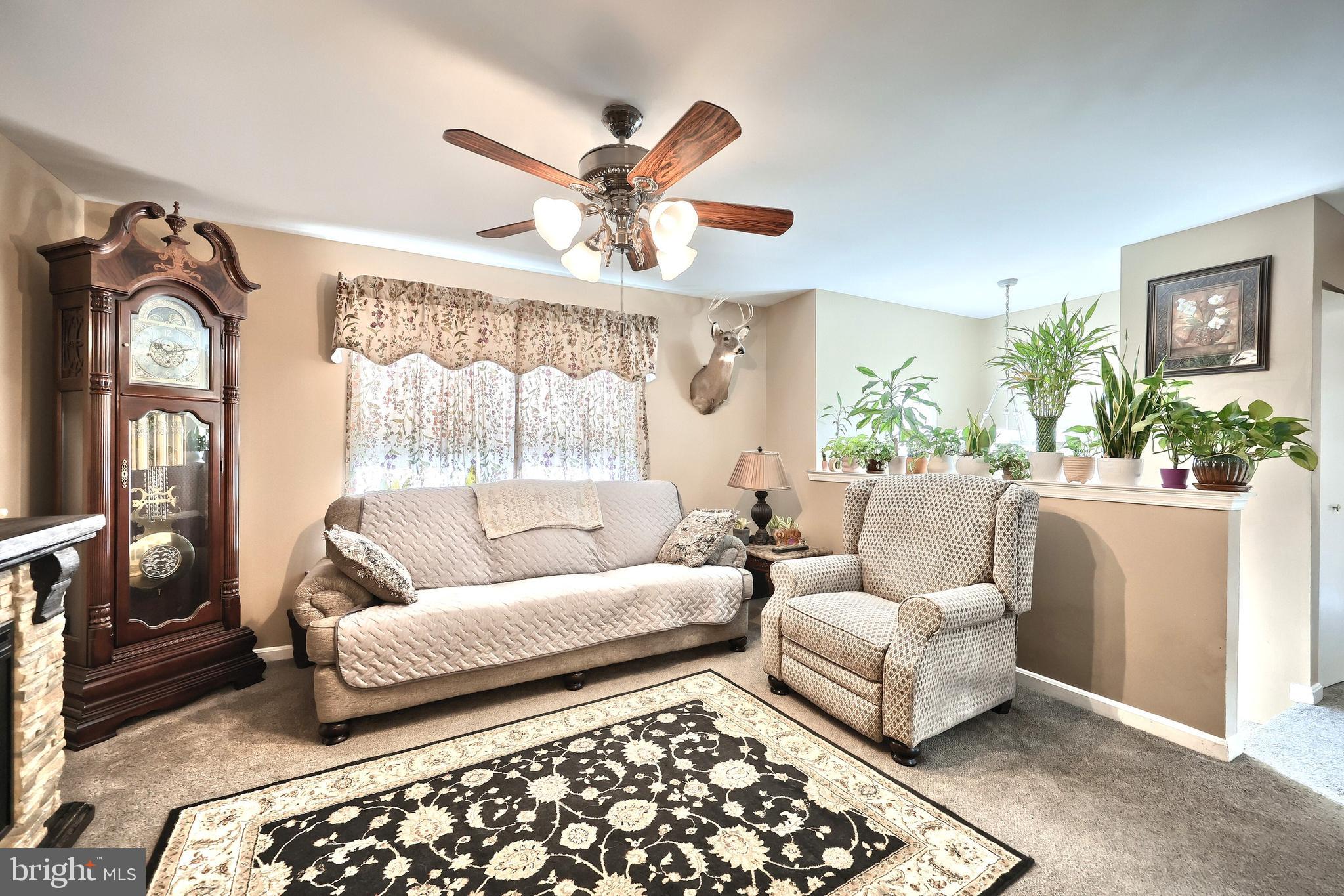 225 Edinburgh Road York, PA 17406 - Photo 12 of 40 a living room with furniture and a large window