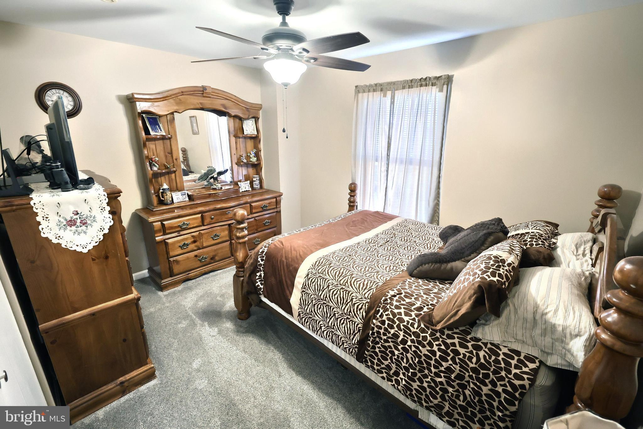 225 Edinburgh Road York, PA 17406 - Photo 13 of 40 a bedroom with a bed and dresser