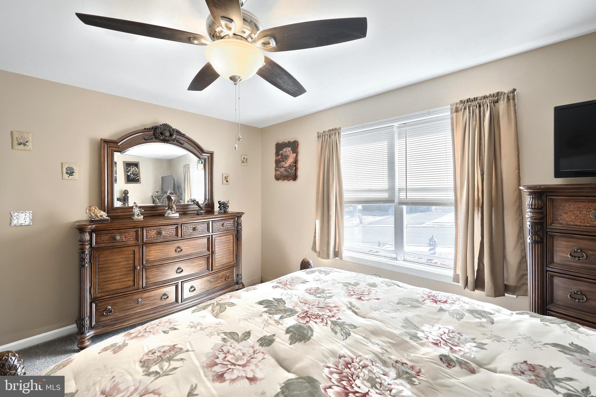 225 Edinburgh Road York, PA 17406 - Photo 15 of 40 a bedroom with a bed window and a television