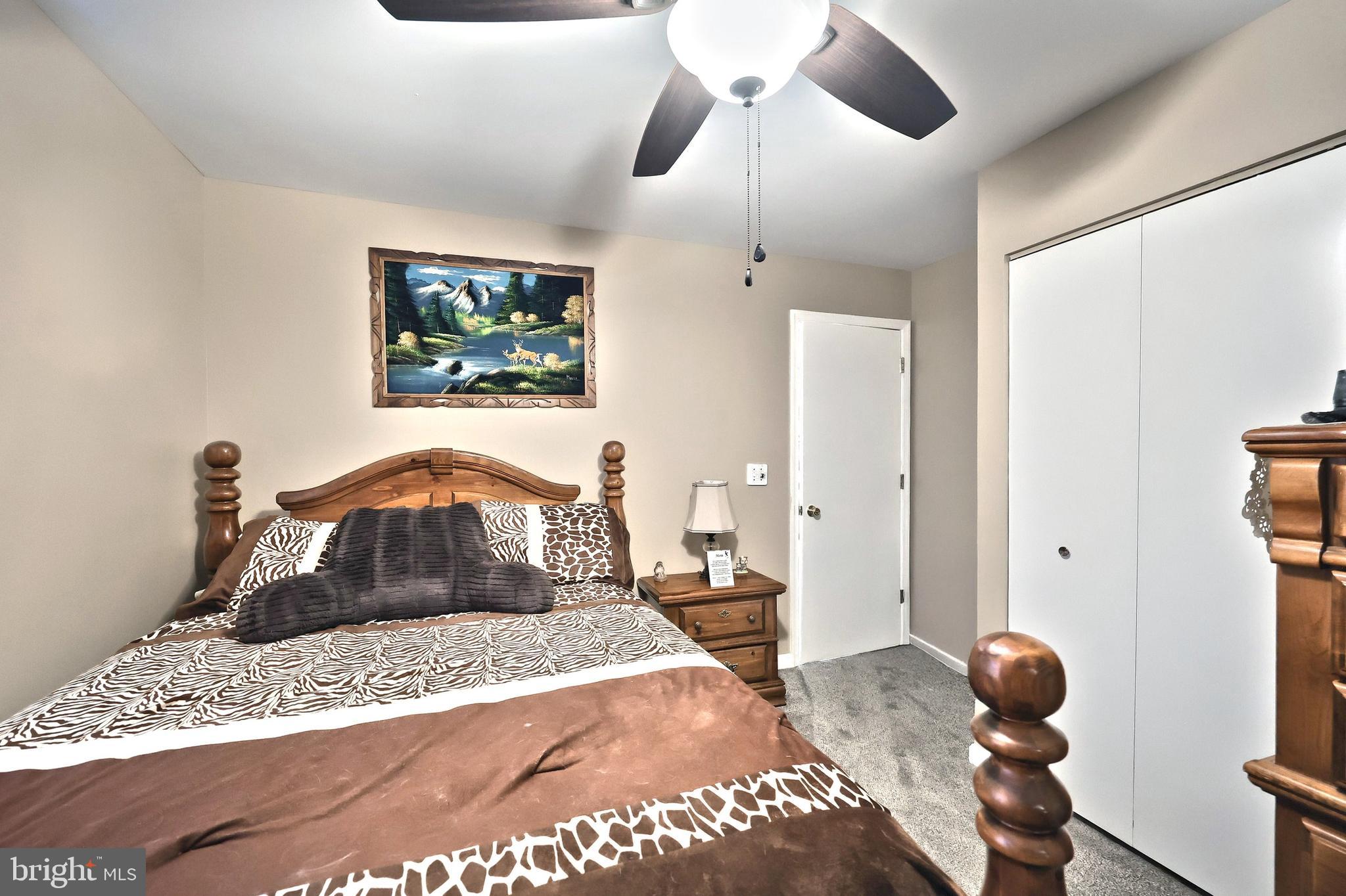 225 Edinburgh Road York, PA 17406 - Photo 17 of 40 a bedroom with a bed and a dresser