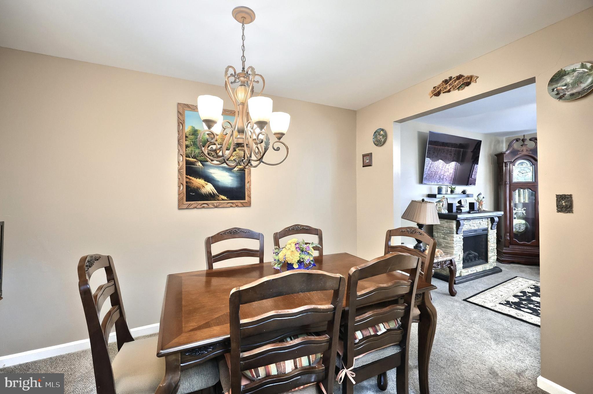 225 Edinburgh Road York, PA 17406 - Photo 8 of 40 a view of a dining room with furniture and chandelier