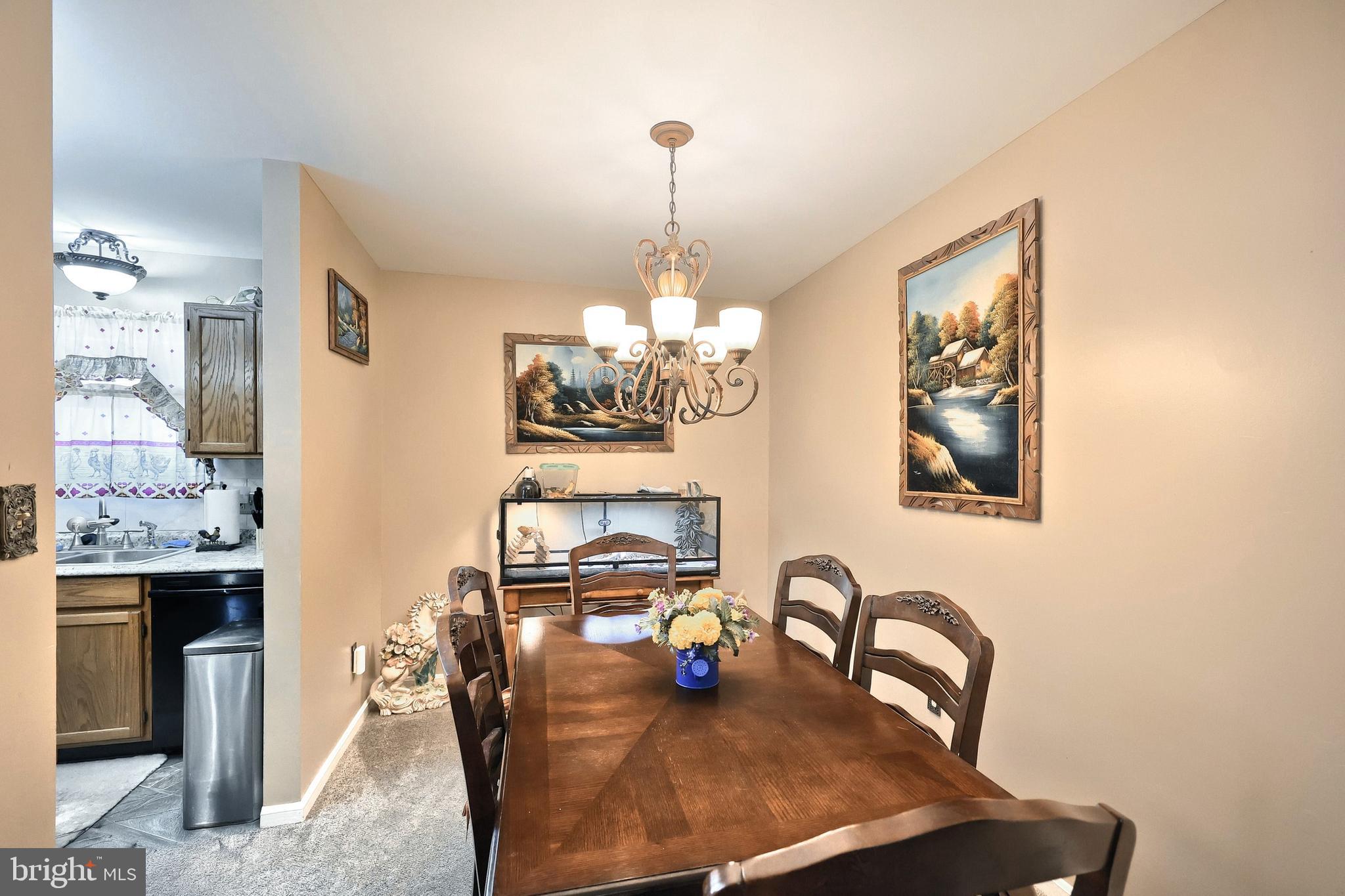225 Edinburgh Road York, PA 17406 - Photo 9 of 40 a dining room with furniture and chandelier