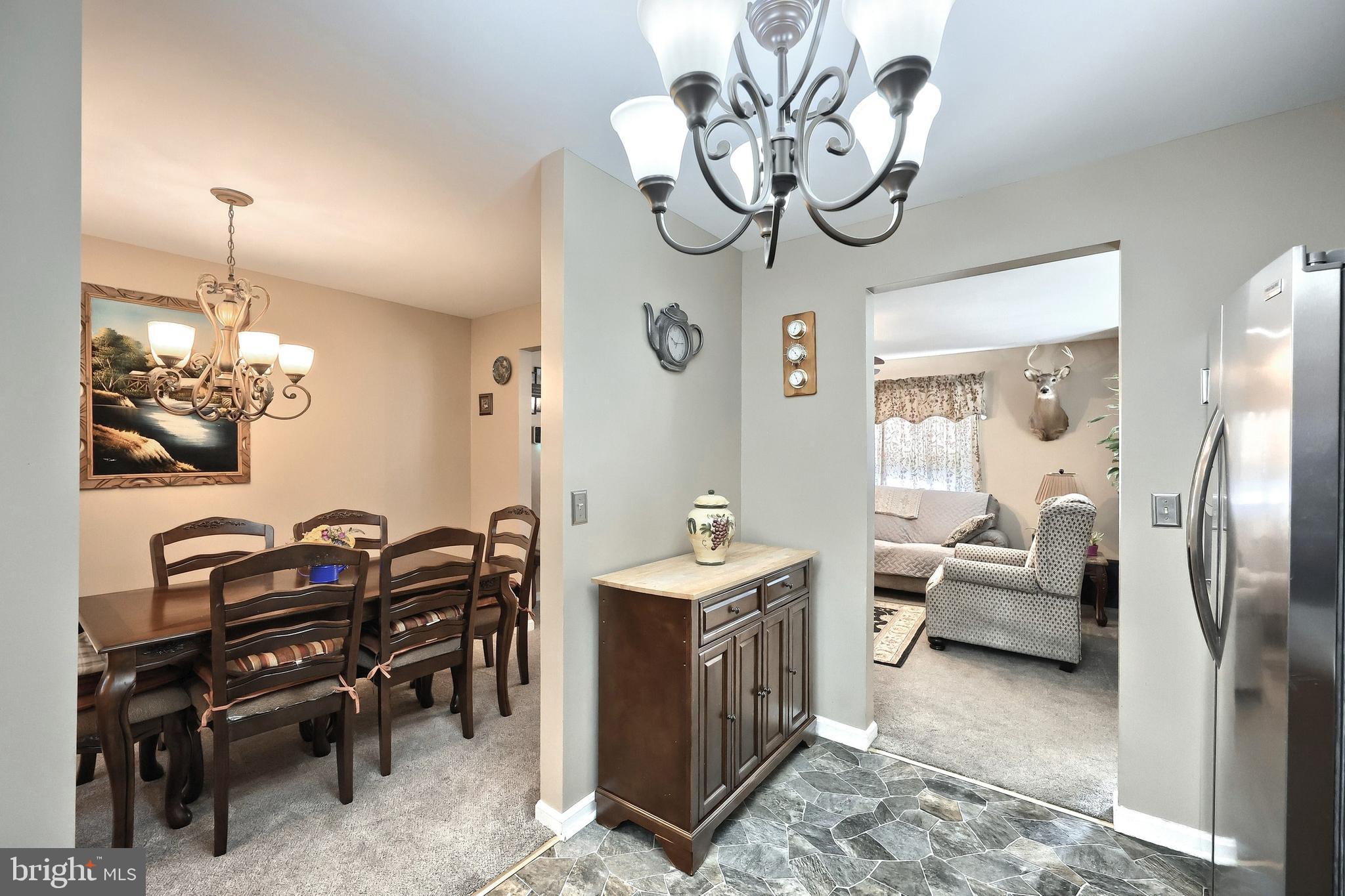 225 Edinburgh Road York, PA 17406 - Photo 10 of 40 a bedroom with furniture and a chandelier