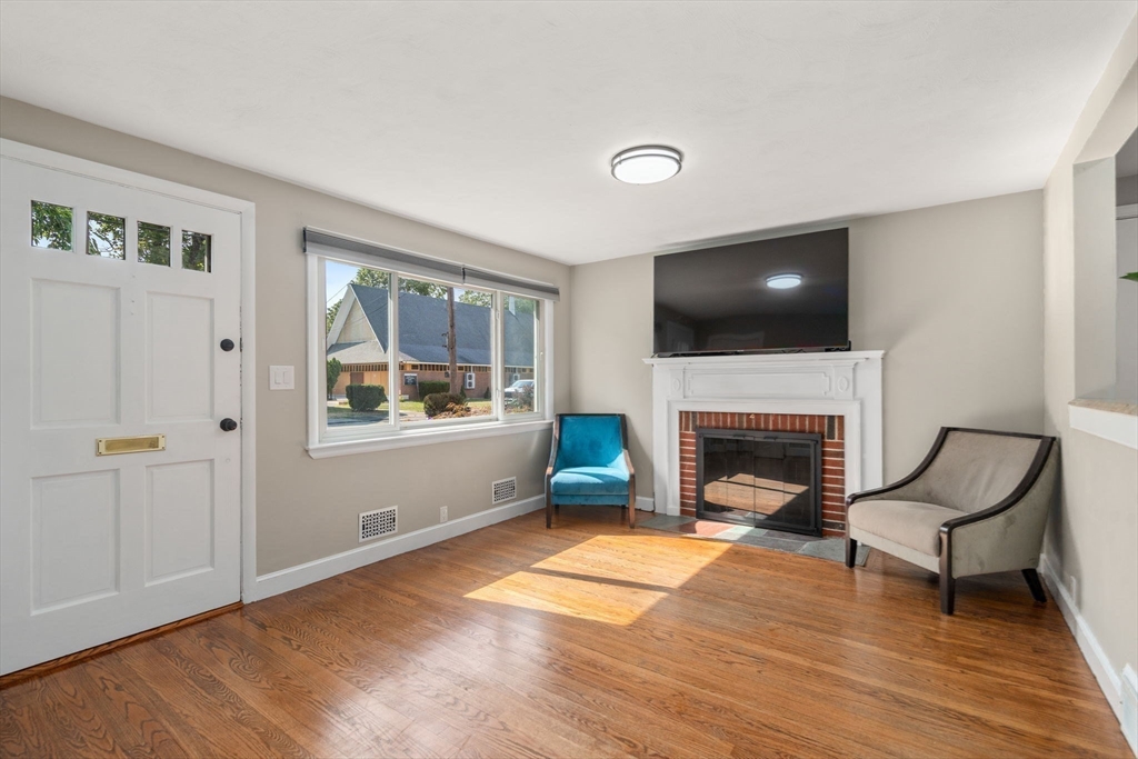 19 Wellesley Road Natick, MA 01760 - Photo 13 of 23 a living room with furniture and a fireplace