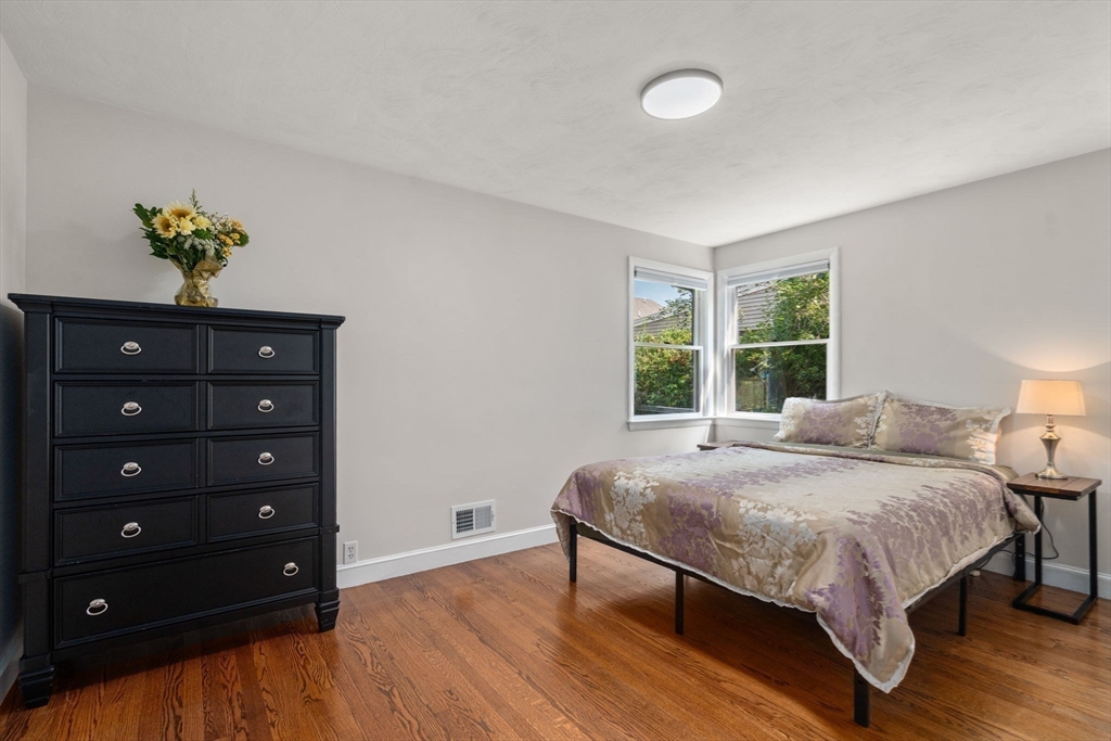 19 Wellesley Road Natick, MA 01760 - Photo 15 of 23 a bedroom with a bed and a window