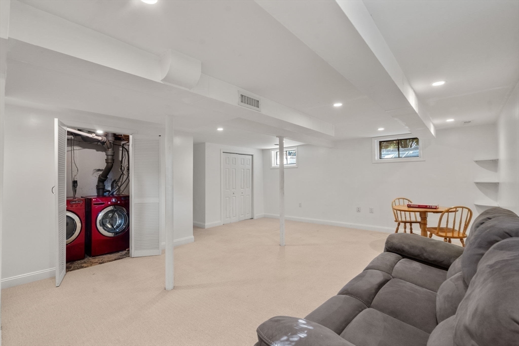 19 Wellesley Road Natick, MA 01760 - Photo 20 of 23 a living room with furniture and a wooden floor