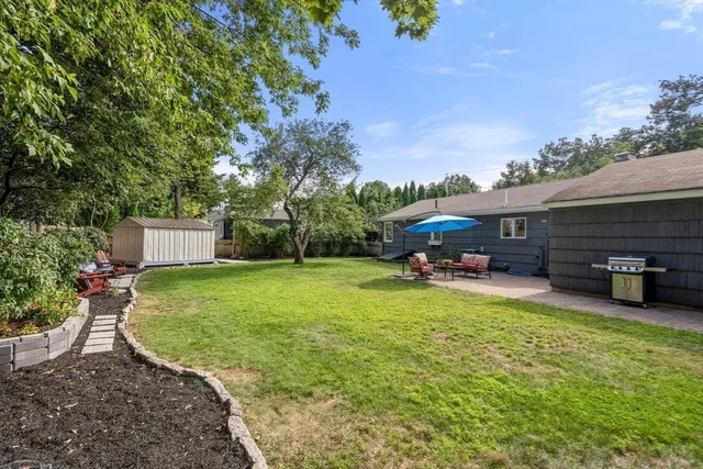 a view of a house with backyard porch and sitting area