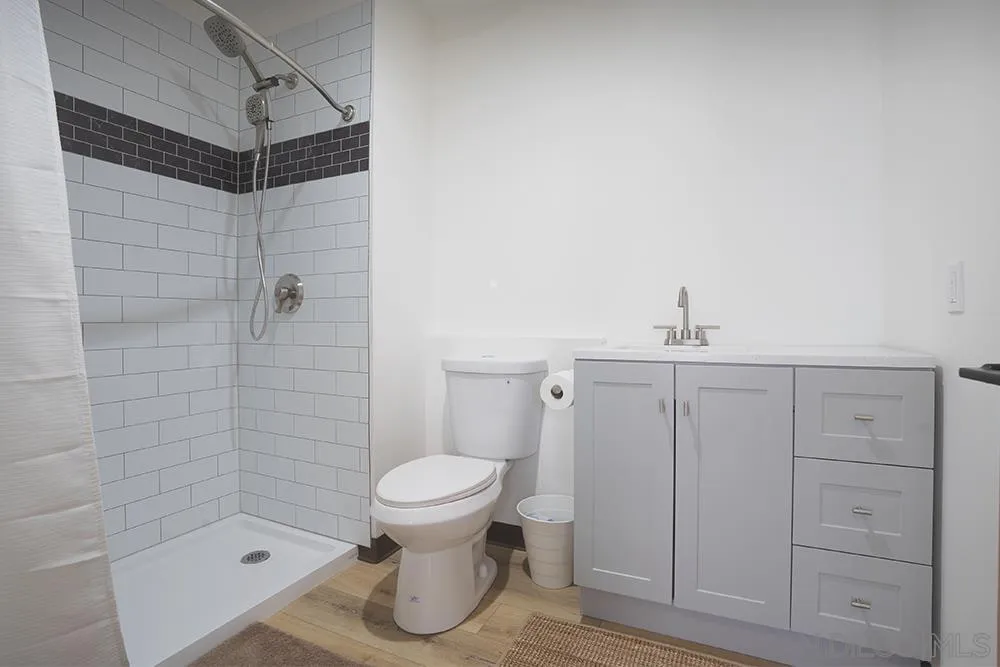 5065 Waterview Way, Unit 101 Oceanside, CA 92057 - Photo 12 of 19 a bathroom with a sink toilet and shower
