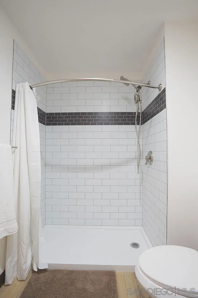 5065 Waterview Way, Unit 101 Oceanside, CA 92057 - Photo 13 of 19 a bathroom with a bathtub and a shower
