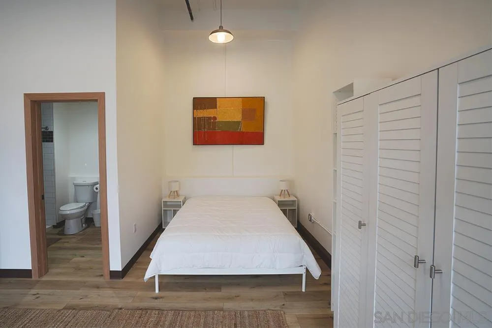 5065 Waterview Way, Unit 101 Oceanside, CA 92057 - Photo 10 of 19 a room with a bed and a view of bathroom