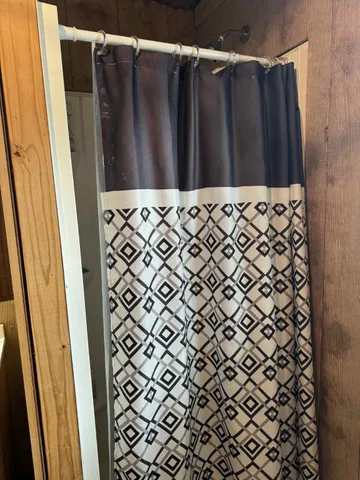 a kitchen with a cabinets and wooden floor