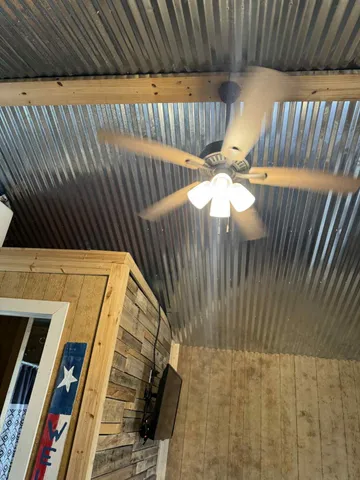 a kitchen with stainless steel appliances kitchen island granite countertop a stove a sink and a refrigerator