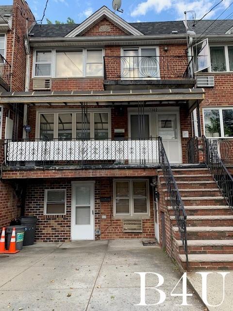 a front view of a house with a garage