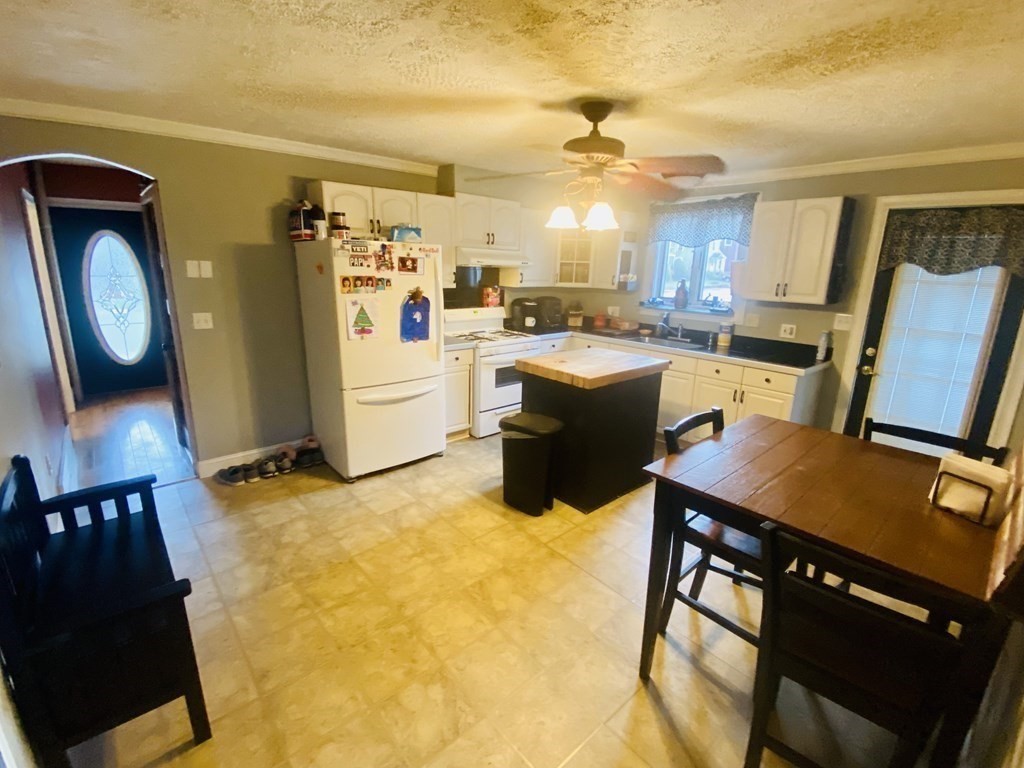 2062 Pleasant Street Three Rivers, MA 01080 - Photo 5 of 38 a view of kitchen with furniture and wooden floor