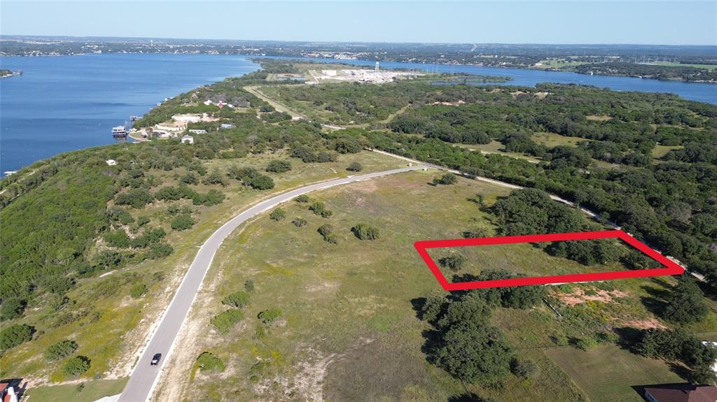 4318 Chicken Gristle Road Granbury, TX 76048 - Photo 2 of 7 a view of a lake with a mountain