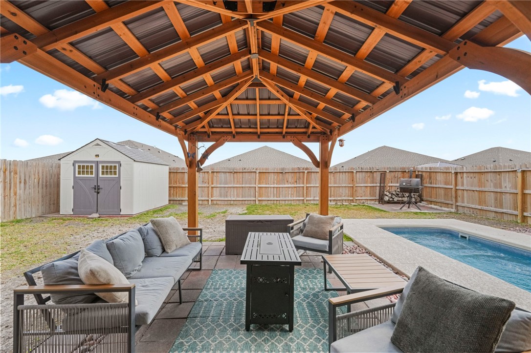 103 Donegal Street Sinton, TX 78387 - Photo 27 of 29 a outdoor space with patio lots of furniture and garden view
