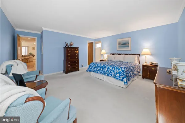 a bedroom with a bed and dresser