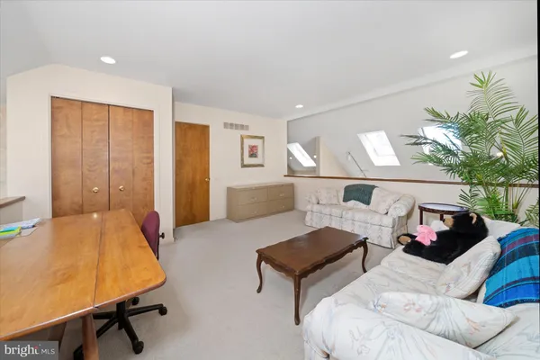 a bedroom with furniture and a bed