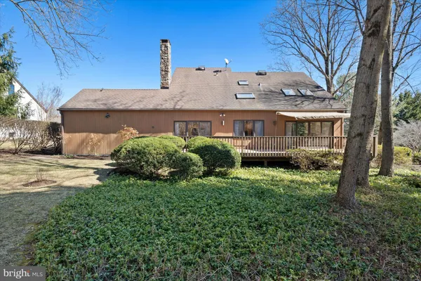 a view of a house with a yard and plants