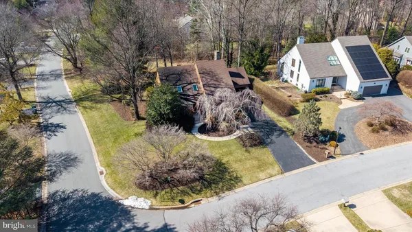 an aerial view of a house with a swimming pool