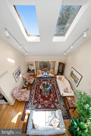 a bed sitting in a bedroom next to a lamp