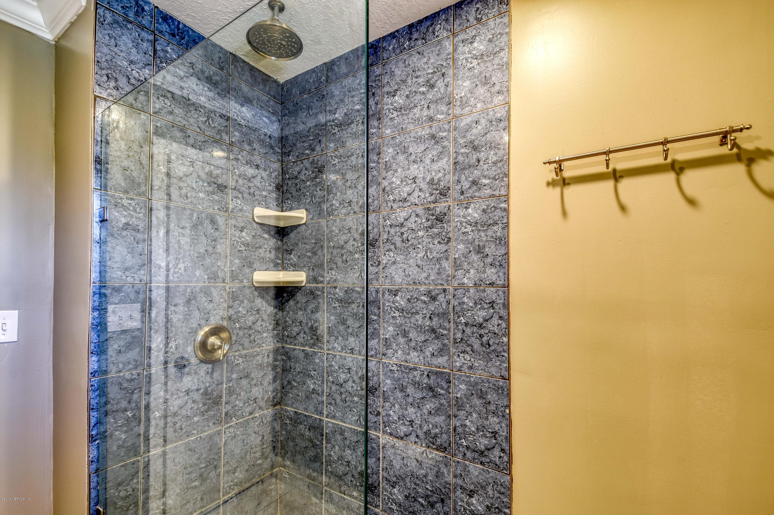 4623 Martingale Road Jacksonville, FL 32210 - Photo 15 of 18 a bathroom with a shower