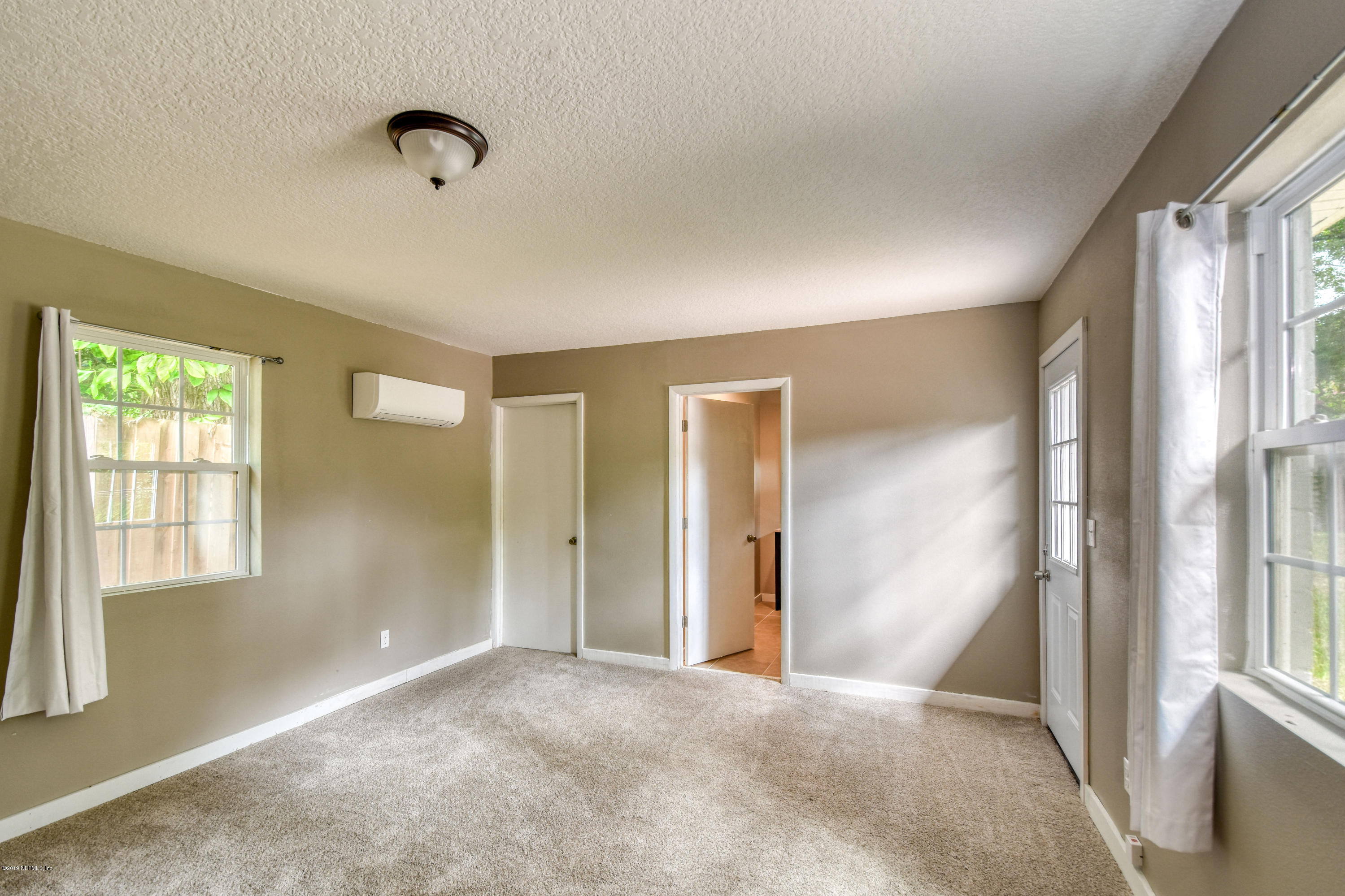 4623 Martingale Road Jacksonville, FL 32210 - Photo 8 of 18 a view of livingroom with window