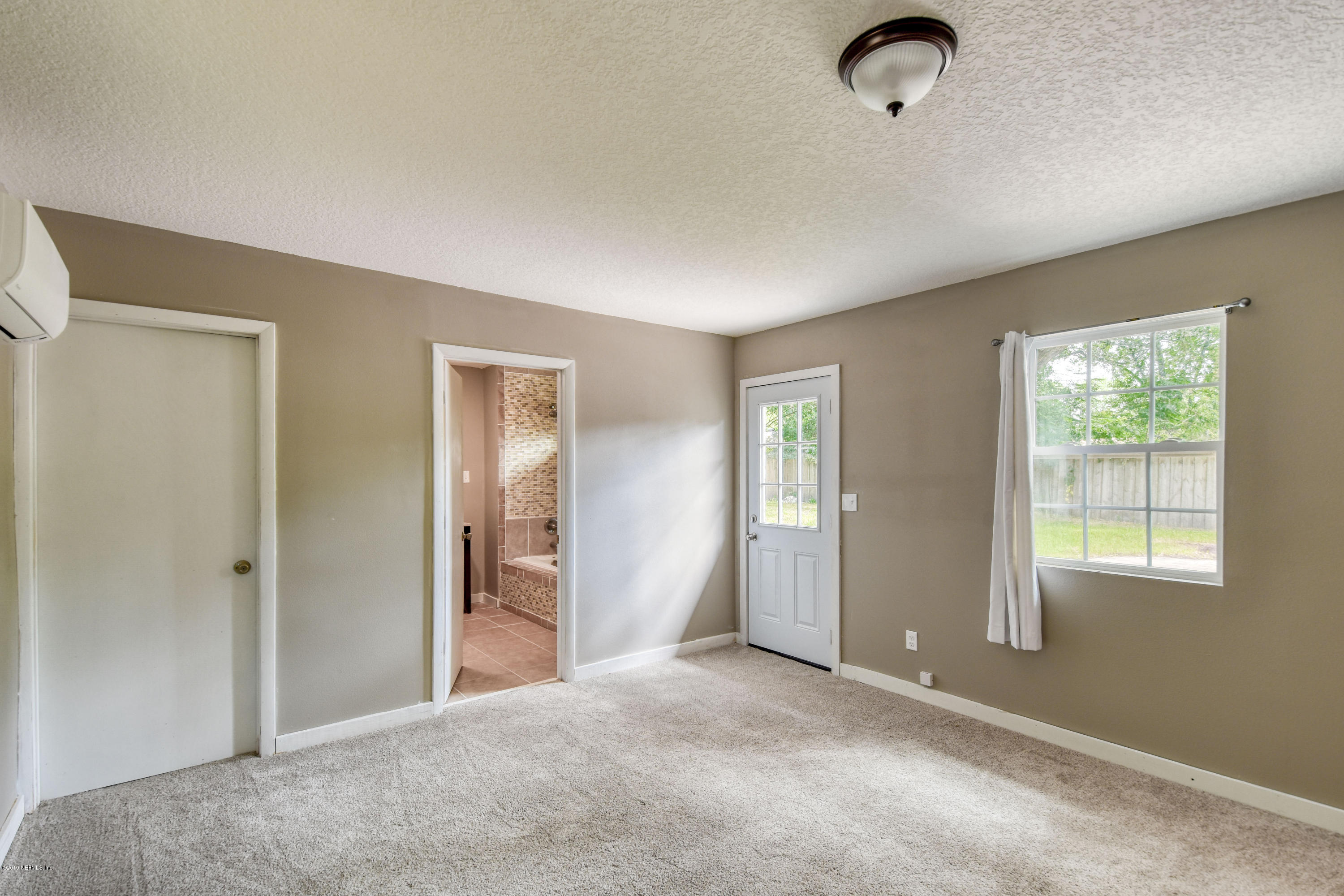 4623 Martingale Road Jacksonville, FL 32210 - Photo 9 of 18 a view of a livingroom with a workspace