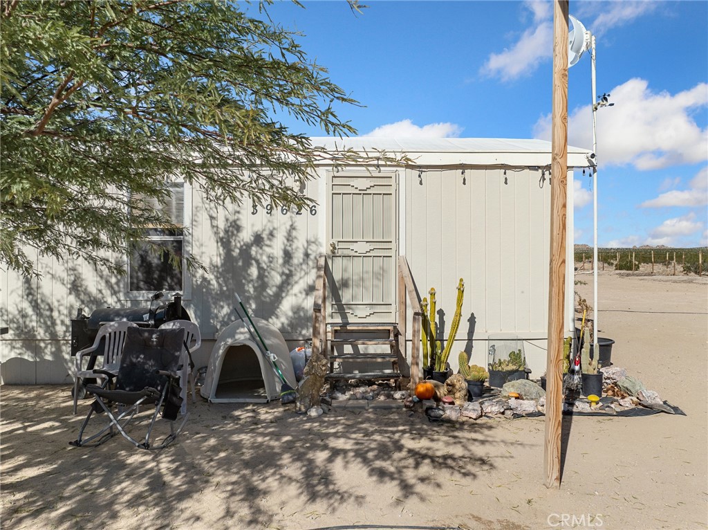 39626 East End Road Lucerne Valley, CA 92356 - Photo 21 of 29 a view of a parked car with small trees