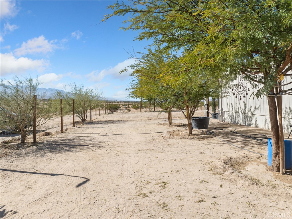39626 East End Road Lucerne Valley, CA 92356 - Photo 22 of 29 a view of yard covered with snow in front of house