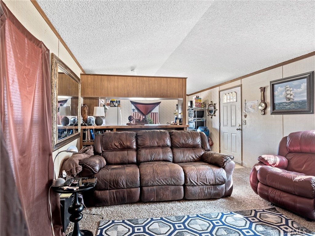 39626 East End Road Lucerne Valley, CA 92356 - Photo 4 of 29 a living room with furniture a couch and a window
