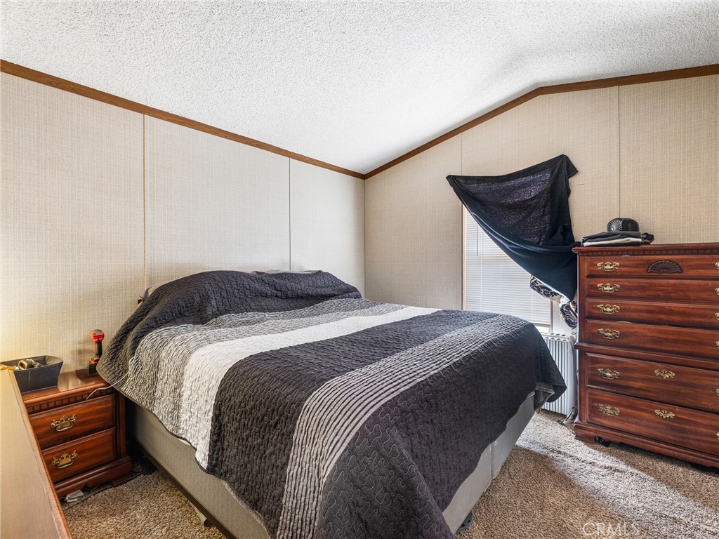 39626 East End Road Lucerne Valley, CA 92356 - Photo 8 of 29 a bedroom with a bed and wooden floor
