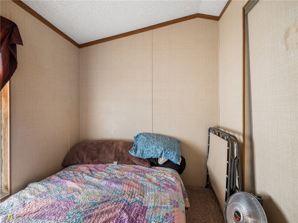 39626 East End Road Lucerne Valley, CA 92356 - Photo 10 of 29 a bedroom with a bed and a mirror