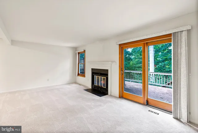 a kitchen with stainless steel appliances granite countertop a refrigerator a stove a sink dishwasher and white countertops with wooden floor