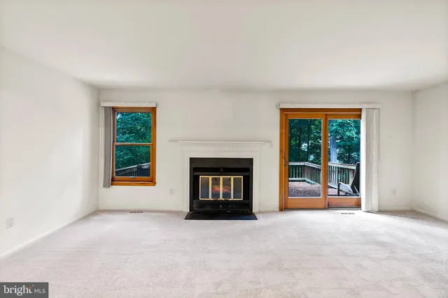 a kitchen with stainless steel appliances granite countertop a sink and cabinets with wooden floor