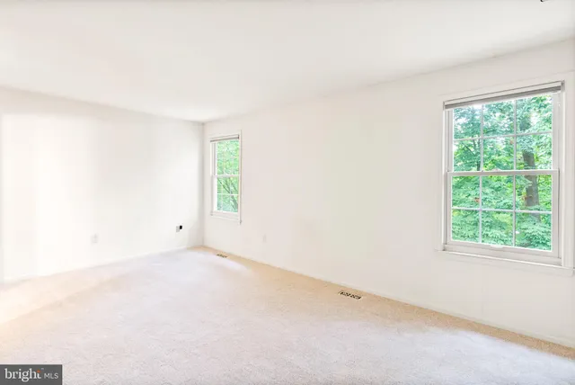 an outdoor view of a house with a balcony
